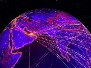 Glooiende blauwe planeet met paarse, oranje en witte lichtlijnen die de verbindingen weergeven.