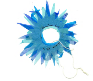 Blauwe papieren ster met de tekst "Christmas day in the morning", met touwtje.